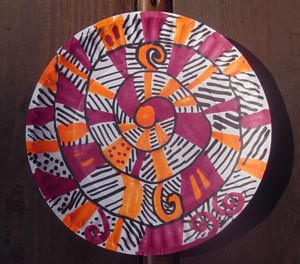 A spiral twirler for decoration, made from a paper plate.