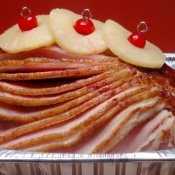 Glazed ham with pineapple on top.