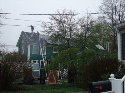 Solar Panels being installed on a house.