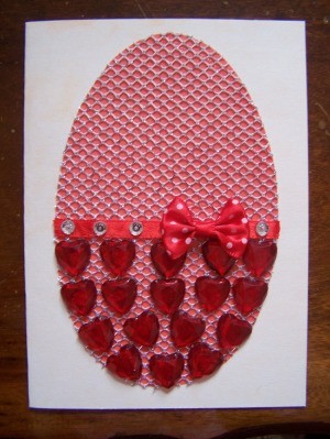 Red heart shaped rhinestones on bottom half.