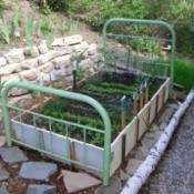 A garden bed made from an old bed frame.