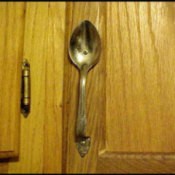 A cabinet with a spoon as hardware.