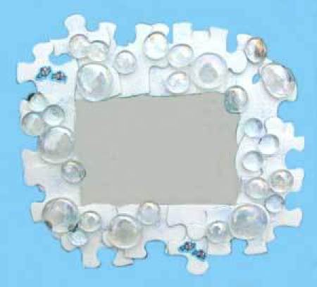 A picture frame made from jigsaw puzzle pieces.