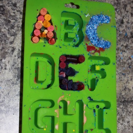 Making recycled letter crayons.