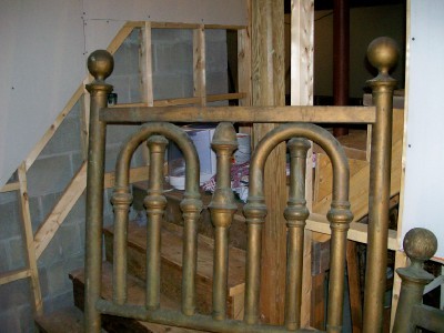 Brass headboard.