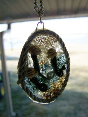 Suncatcher Pendant in a window.