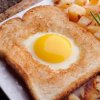 Egg cooked in middle of bread slice.