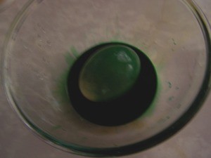 Deluxe Easter Eggs - Dipping egg into dye.