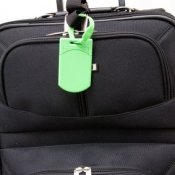 Generic black suitcase with bright green tag.