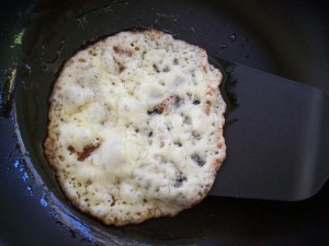 Provolone cheese being fried