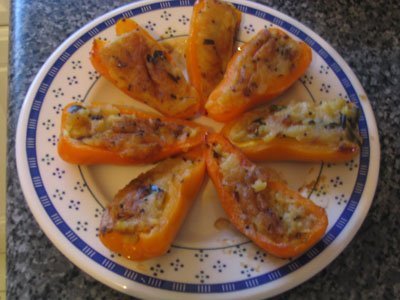 Plate of stuffed yellow pepper halves.