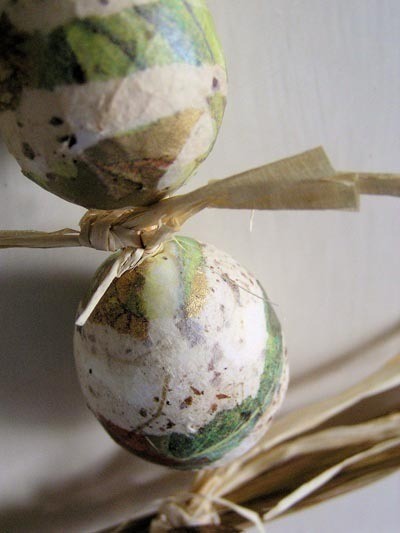 Decoupaged Easter eggs made from strips of paper.