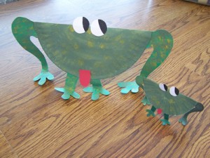 large and small green paper plate frogs