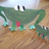 large and small green paper plate frogs