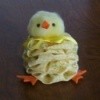 A cute chick made from fabric yo-yos.