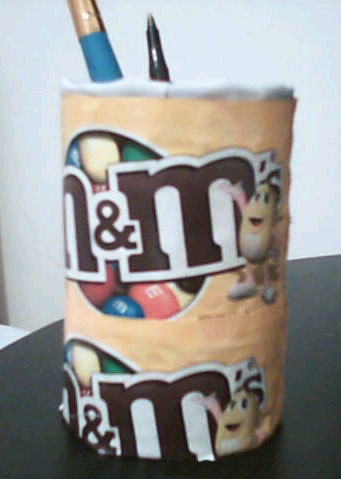 Recycle Cans and Packaging Into Storage Containers - decorated with M & M wrappers.