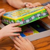 A family opening a board game.
