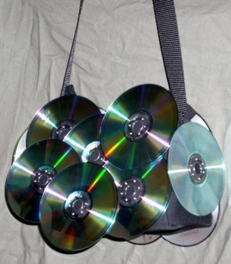 Purse decorated with CDs.