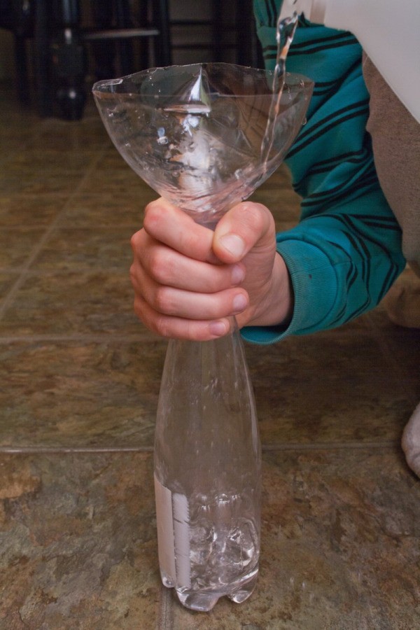 Pouring Vinegar for Balloon Experiment