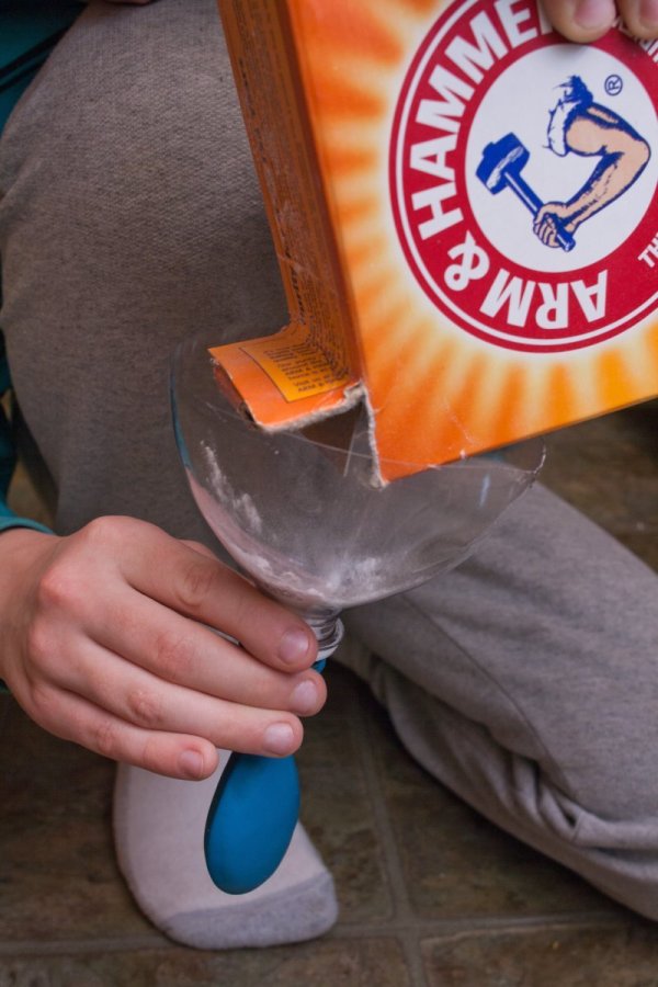 Pouring Baking Soda for Balloon Experiment