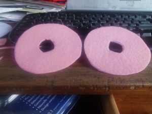 Two pink felt circles