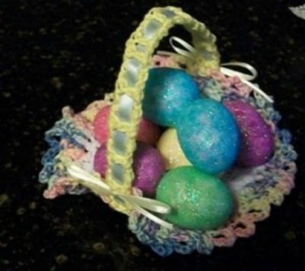 Crochet Easter basket with colored eggs.