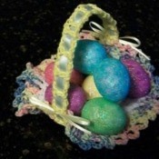 Crochet Easter basket with colored eggs.
