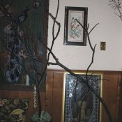 Potted painted tree branches.