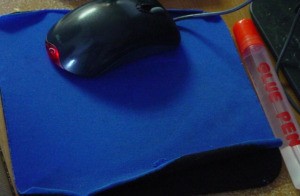 Fix That Mousepad, an old mousepad that is peeling up on the sides.