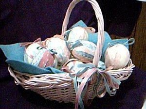 Basket of fabric wrapped foam eggs.