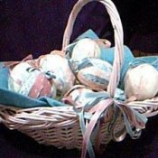 Basket of fabric wrapped foam eggs.