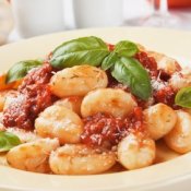 Gnocchi on Plate With Basil and Tomato
