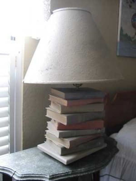 A lamp with stacked books as the base.