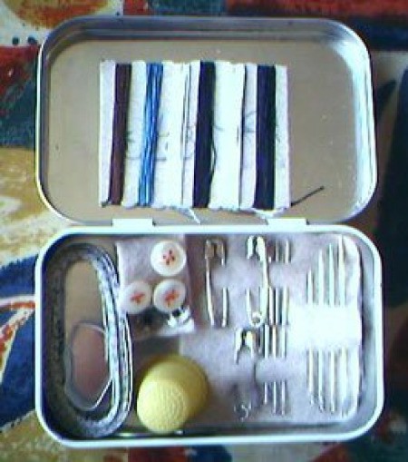 Sewing kit in an Altoids tin.