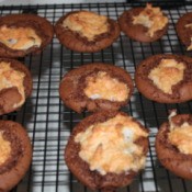 Snowcapped Fudge Cookies on a cooling rack.