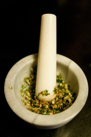 Mortar and Pestle With Ground Spices and Garlic