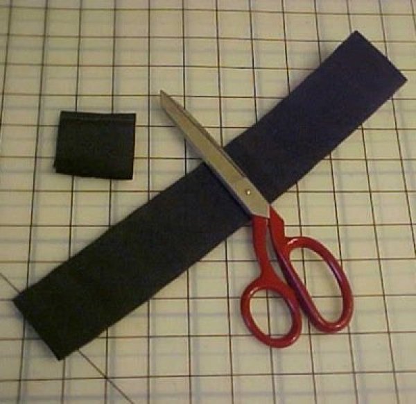Cutting Velcro sections.