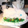 Easter Bunny Cake, fully decorated with green coconut grass and jelly beans.