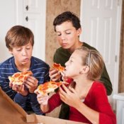 Teens Eating Pizza