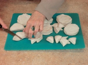 Cutting biscuits into sixths.