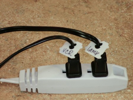 Bread ties marking cords on a power strip.