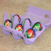 Cadbury eggs in painted egg crate.