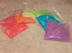 Bags of rainbow dyed rice.