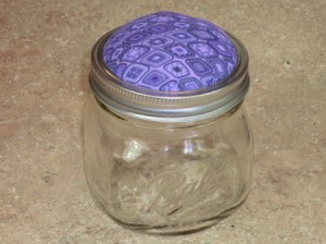 finished pincushion atop jar
