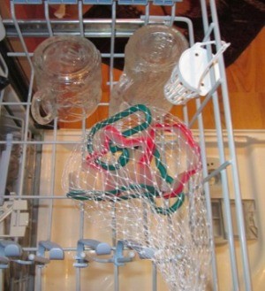 Cookie cutters inside a mesh bag in the dishwasher