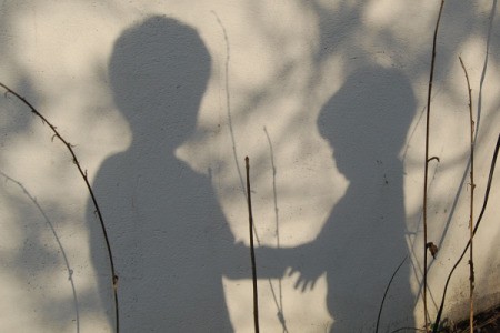 Shadows of Boys holding hands