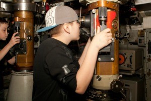 Boy Looking Through Submarine Periscope