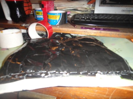 Stapling together the purse.