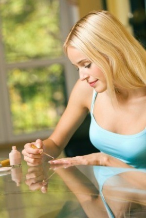Woman Giving Herself a Manicure