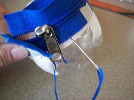 Sew zipper to plastic bottle